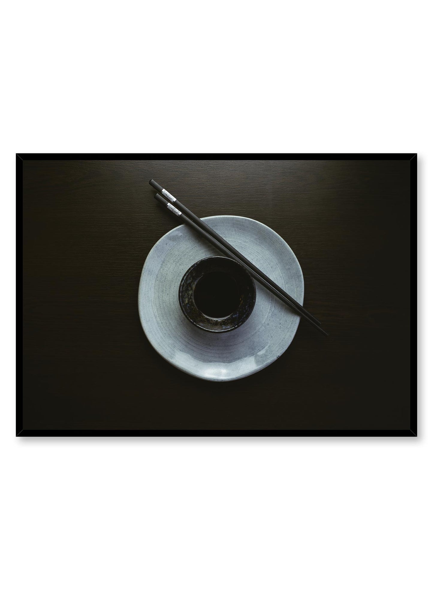 Inku is a minimalist photography by Opposite Wall of a pair of chopsticks on a plate with a saucer in the center.