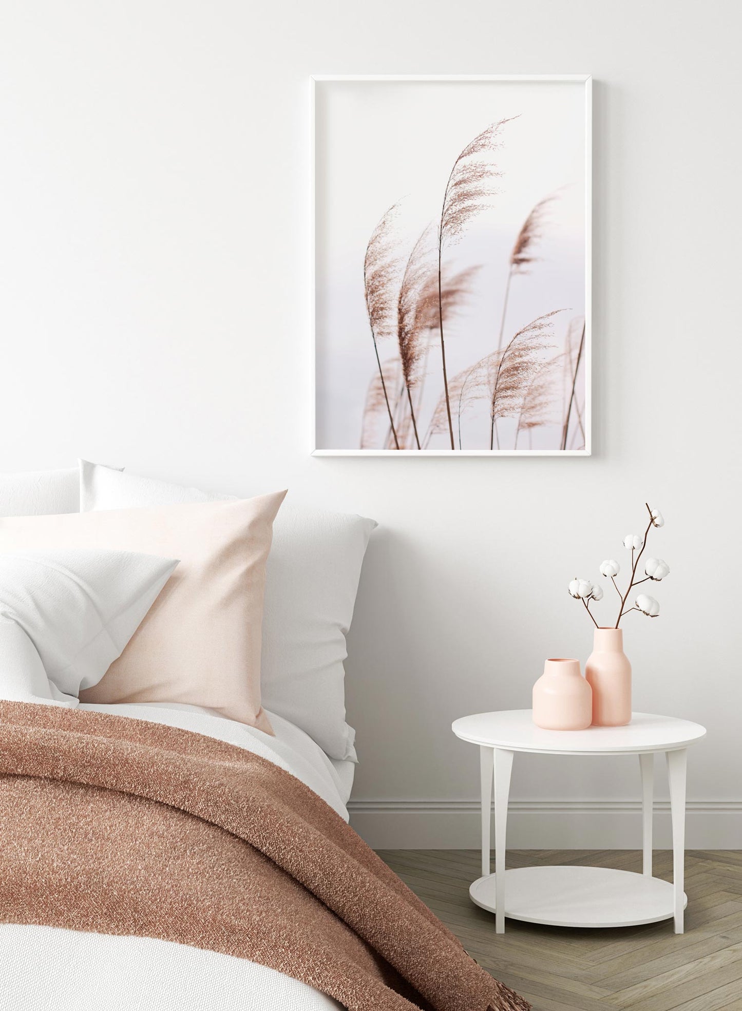 "Feathery Grasses" is a botanical photography poster by Opposite Wall of tall and feathery brown grasses over a grey sky.