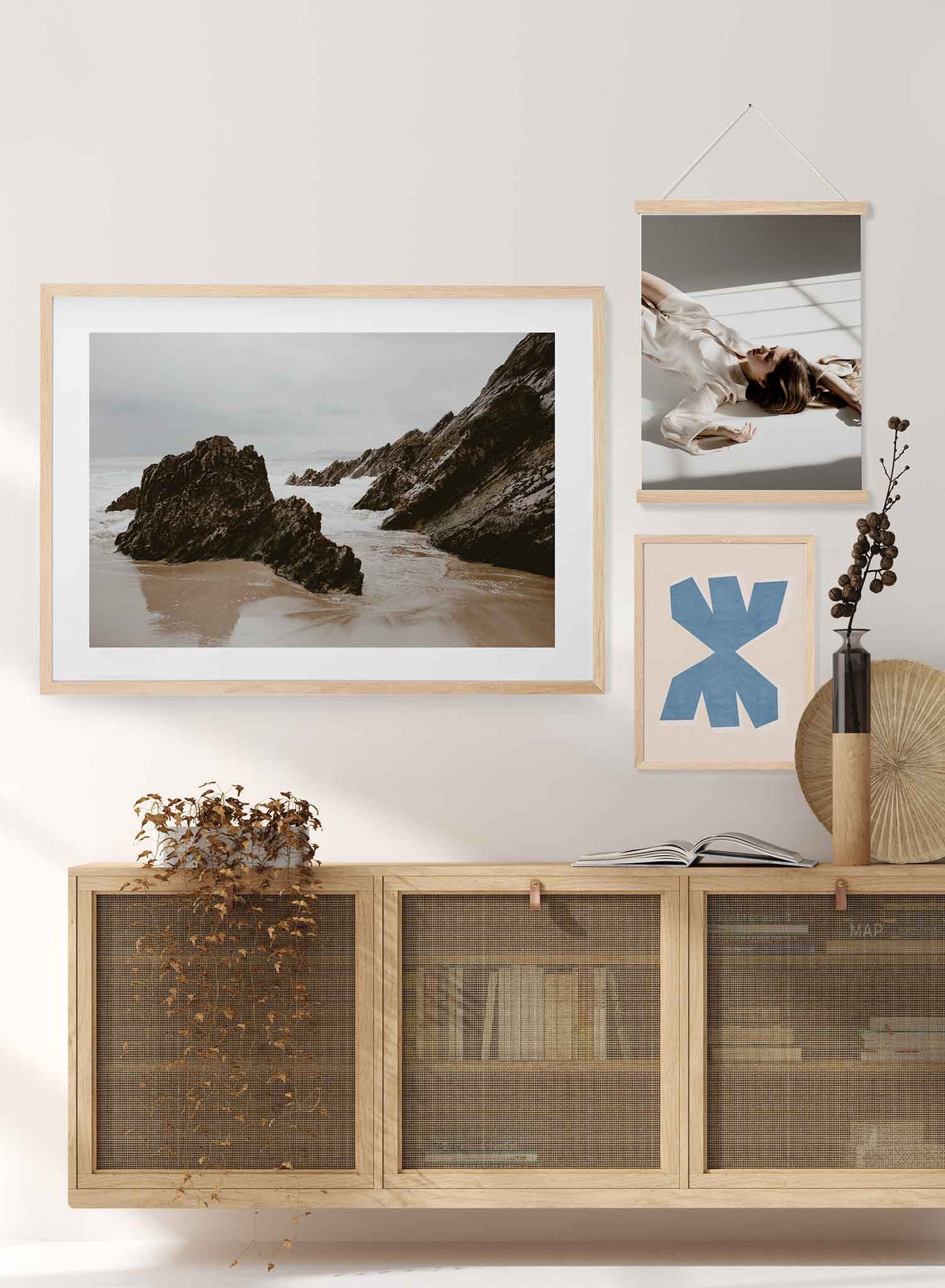 Irish Boulders' is a landscape photography poster by Opposite Wall of tall rock boulders on a cloudy and peaceful beach in Ireland.