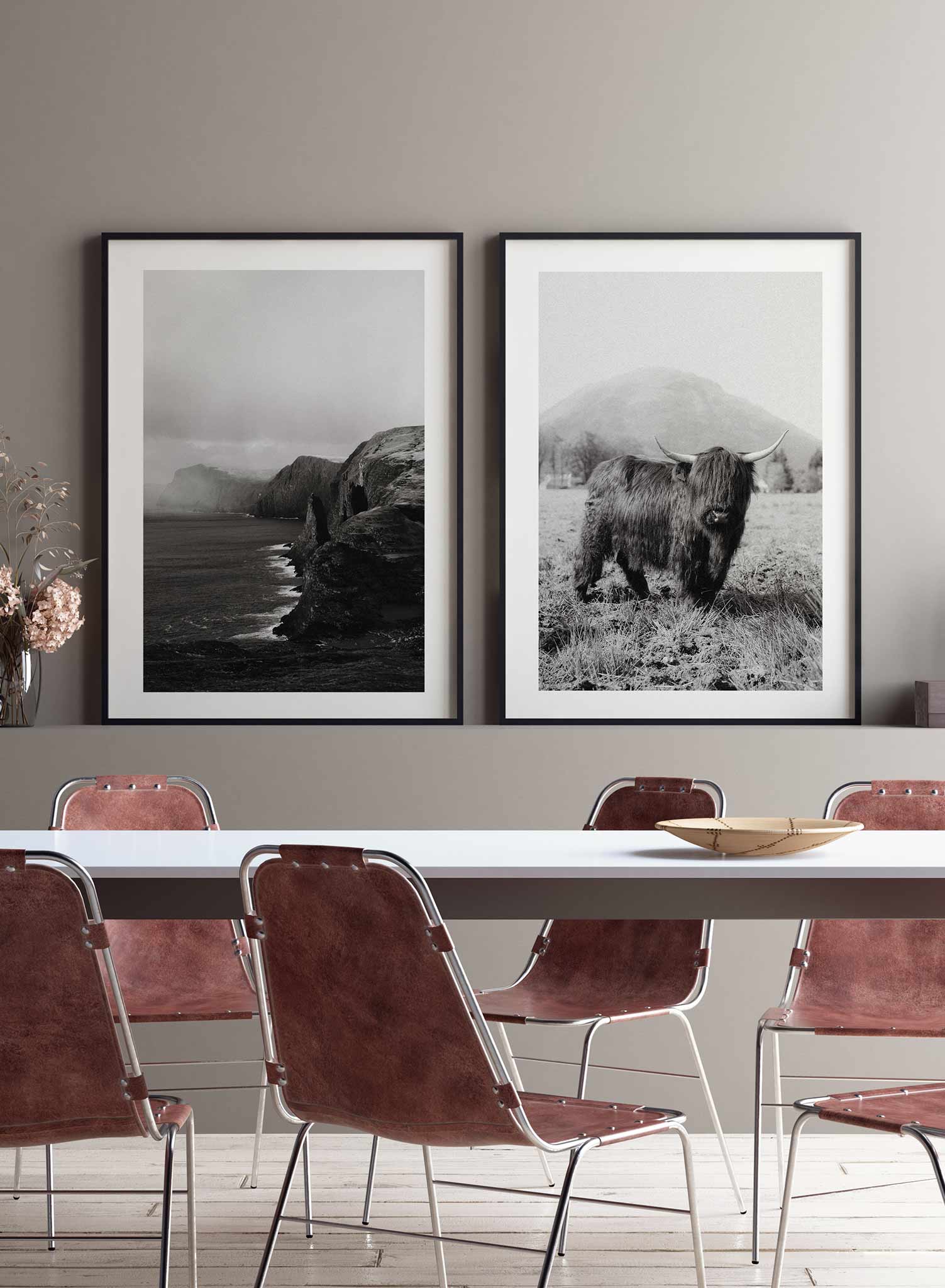 Highland Cow' is a black & white animal photography poster by Opposite Wall of a friendly looking Highland cow standing in front of a beautiful mountain landscape in Ireland.