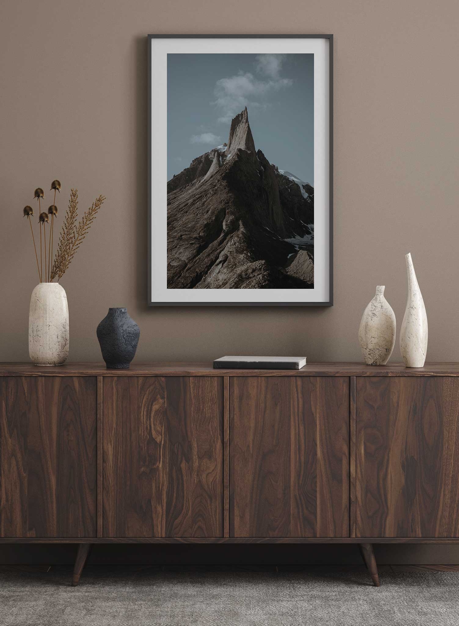 Pinnacle' is landscape photography poster by Opposite Wall of the peak of a tall and snowy rocky mountain under a clear blue sky.