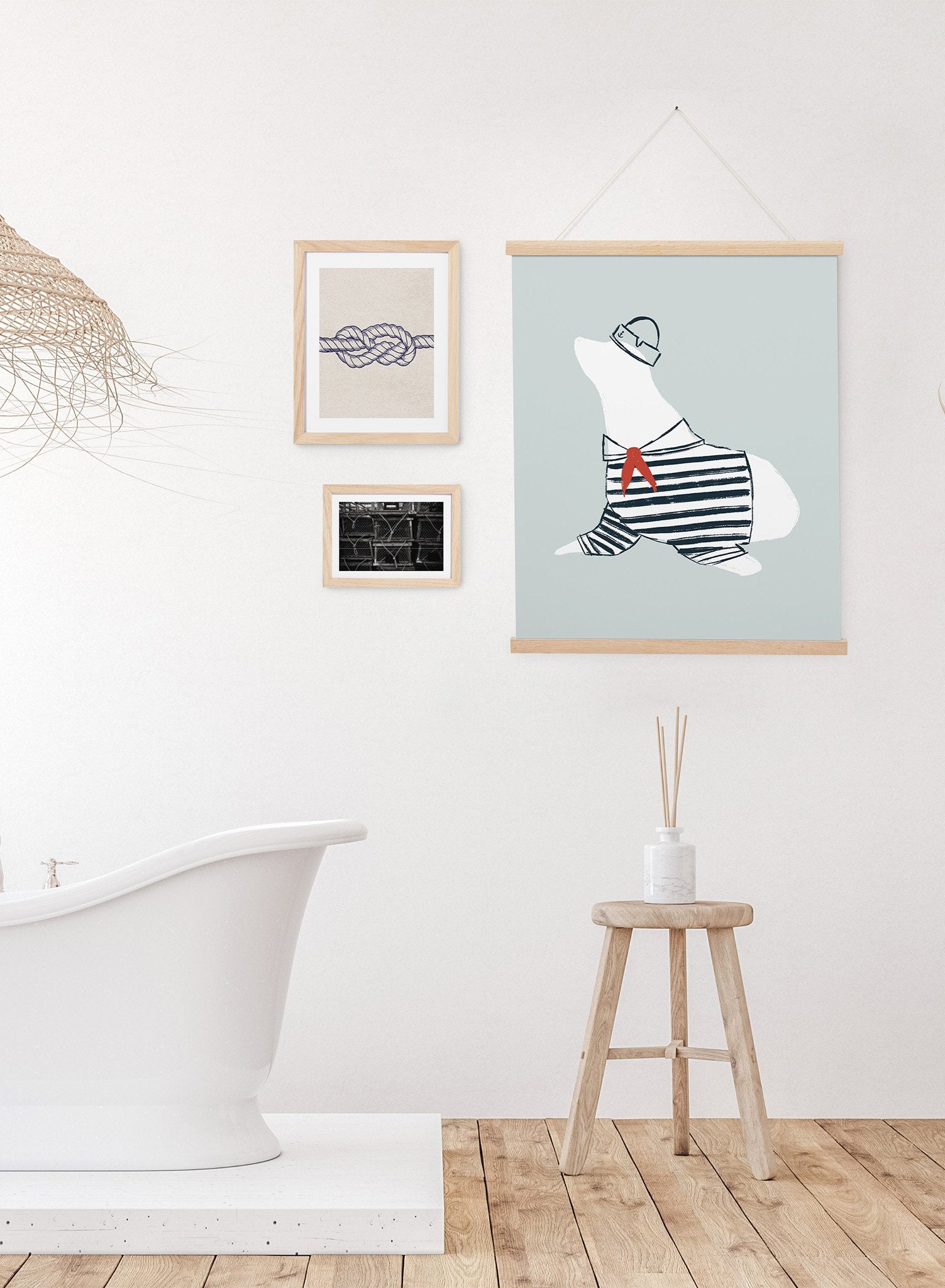 Seal Sailor is a minimalist illustration of white seal wearing a dark blue sailor outfit with a matching Dixie cup hat and a red scarf by Opposite Wall.