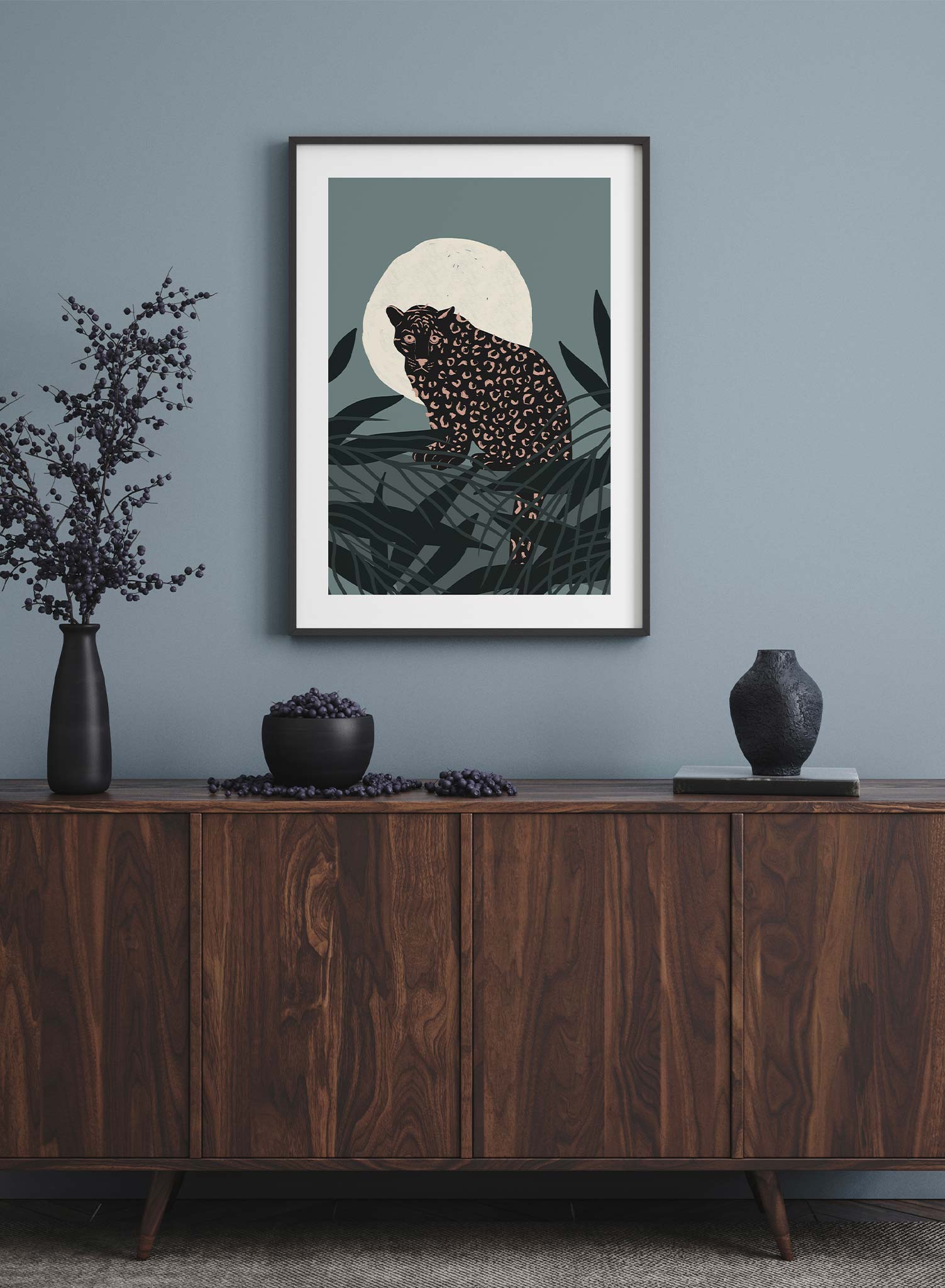 Cheetah in the Moonlight is a minimalist illustration of a fierce cheetah staring at the observer while standing in front of a full moon by Opposite Wall.