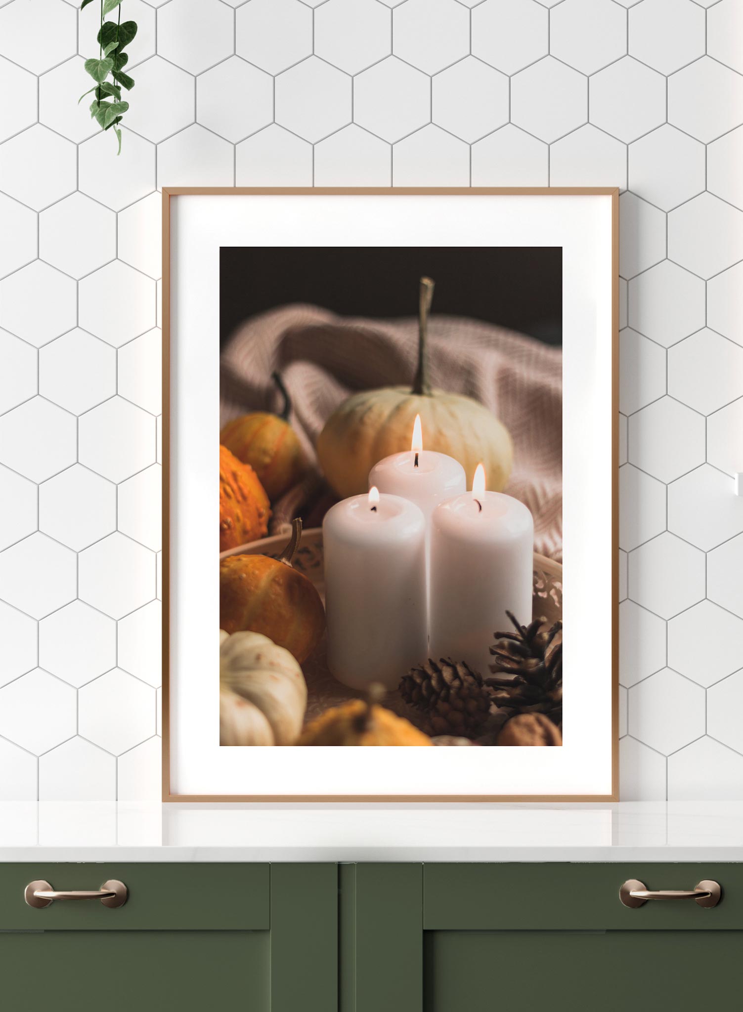 Candlelit is a minimalist photography by Opposite Wall of three lit candles surrounded by small pumpkins.