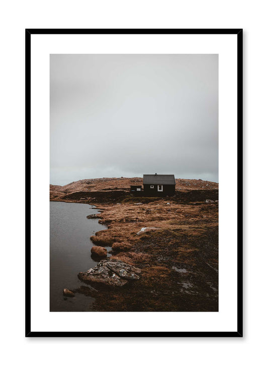 Lakeside View' is a landscape photography poster by Opposite Wall of a quaint cottage style house on orange and brown grass overlooking a quiet lake under a cloudy grey sky.