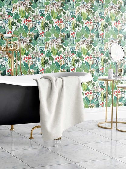 Tropicalia is a minimalist wallpaper by Opposite Wall of a variety of tropical plant leaves.